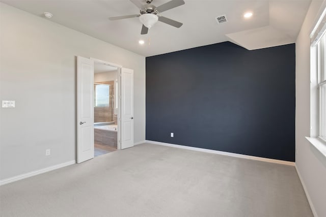 carpeted empty room featuring ceiling fan