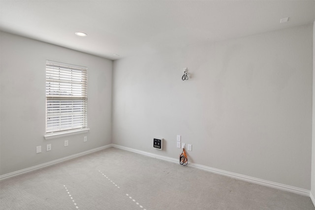 empty room featuring light carpet