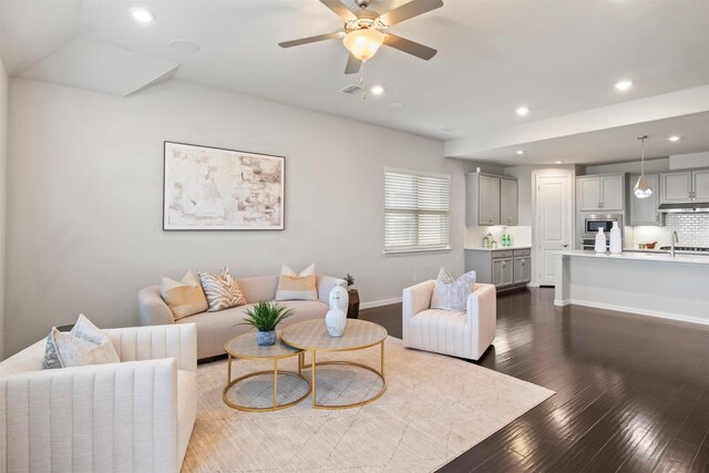 entrance foyer with dark hardwood / wood-style floors and an inviting chandelier