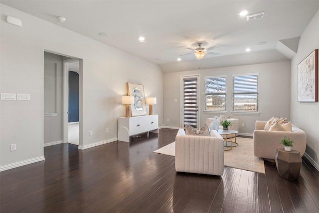 living room featuring ceiling fan, lofted ceiling, and dark hardwood / wood-style flooring