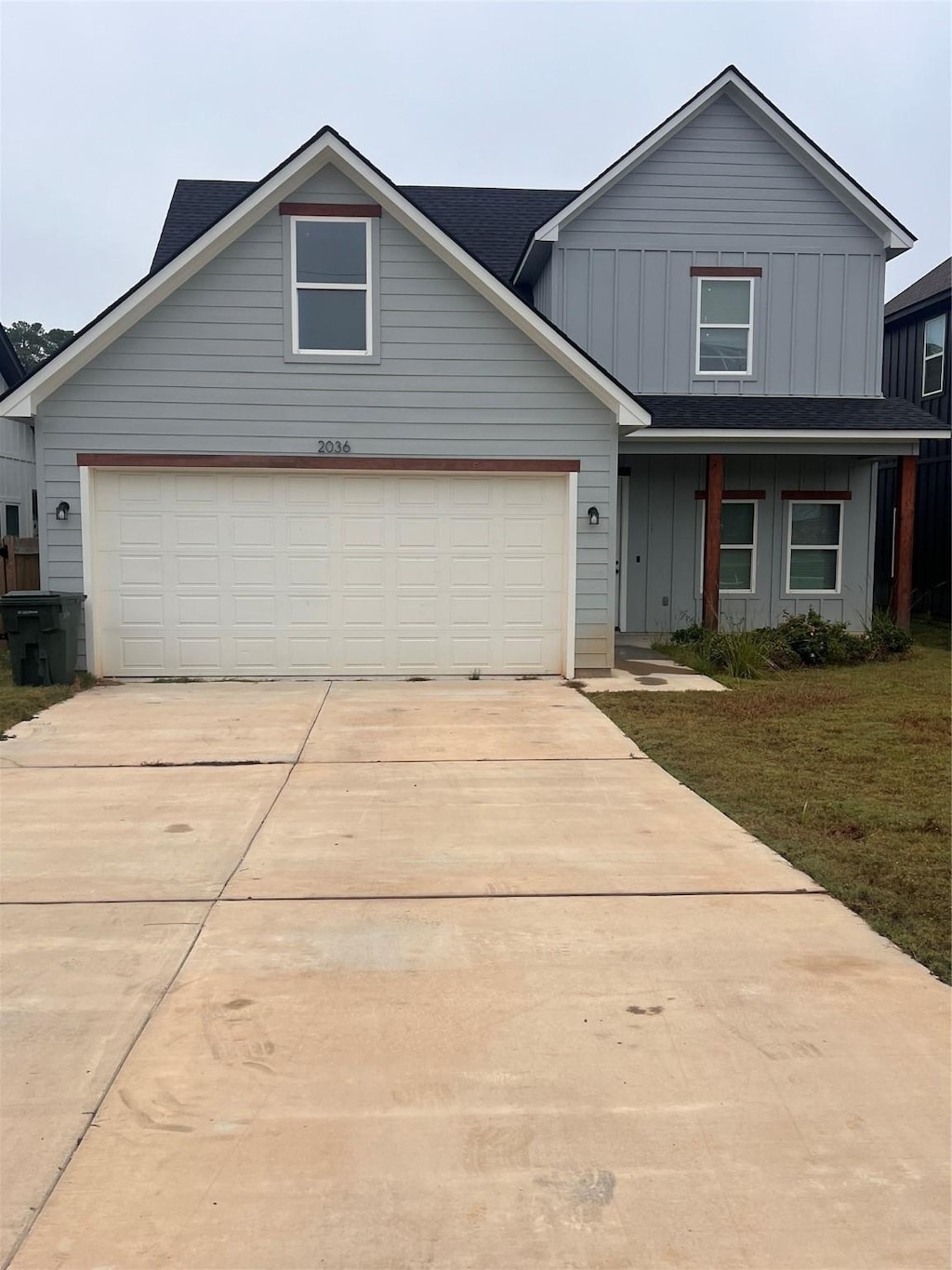 view of front of house with a front yard and a garage