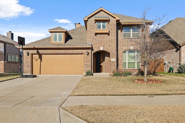 view of front of home with a front lawn and a garage