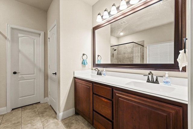 bathroom with vanity, tile patterned floors, and walk in shower