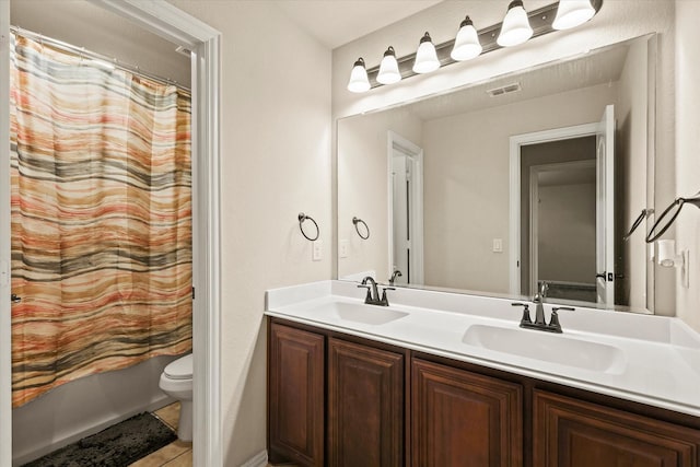 full bathroom featuring vanity, toilet, and shower / bath combo