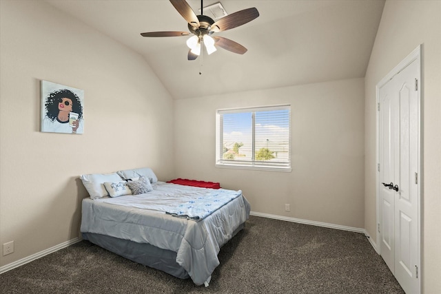 carpeted bedroom featuring a closet, ceiling fan, and lofted ceiling