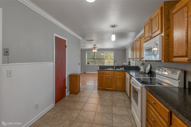 kitchen featuring sink, hanging light fixtures, ornamental molding, kitchen peninsula, and white appliances