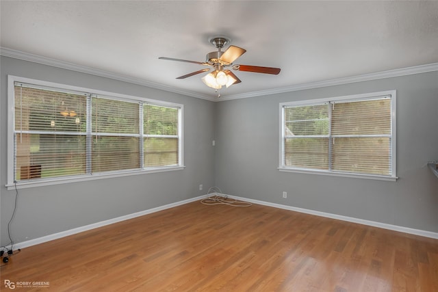 unfurnished room with ceiling fan, ornamental molding, and hardwood / wood-style floors