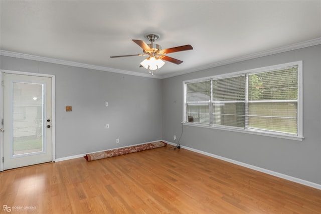 empty room with crown molding, ceiling fan, and light hardwood / wood-style floors