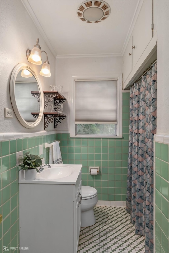 bathroom featuring ornamental molding, tile walls, and toilet