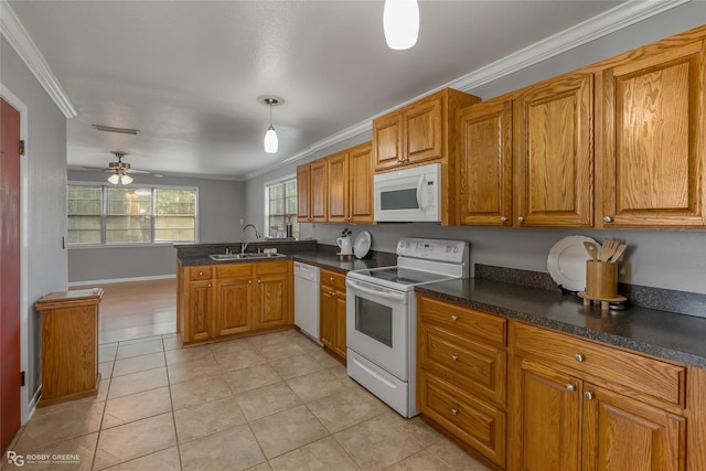 kitchen featuring pendant lighting, sink, white appliances, ornamental molding, and kitchen peninsula