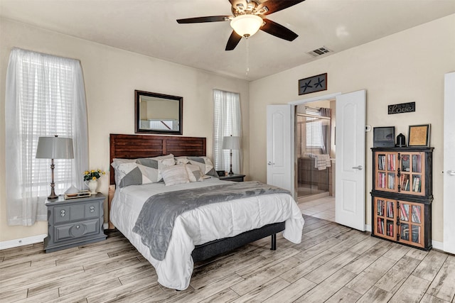 bedroom featuring ensuite bathroom and ceiling fan