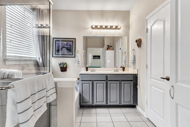 bathroom with tile patterned floors and vanity