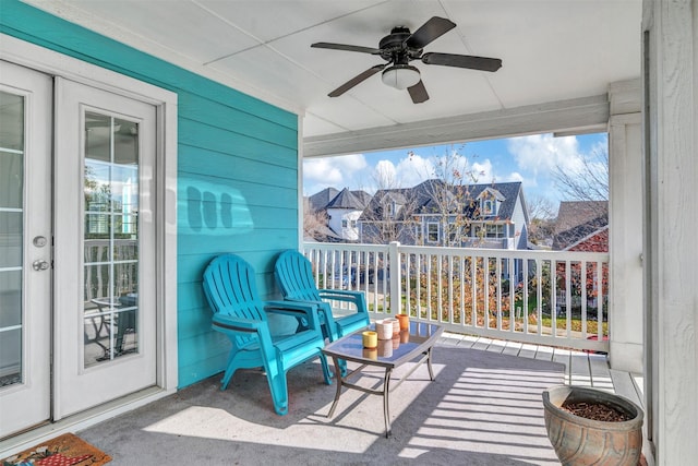 sunroom / solarium featuring ceiling fan