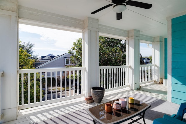 exterior space featuring ceiling fan