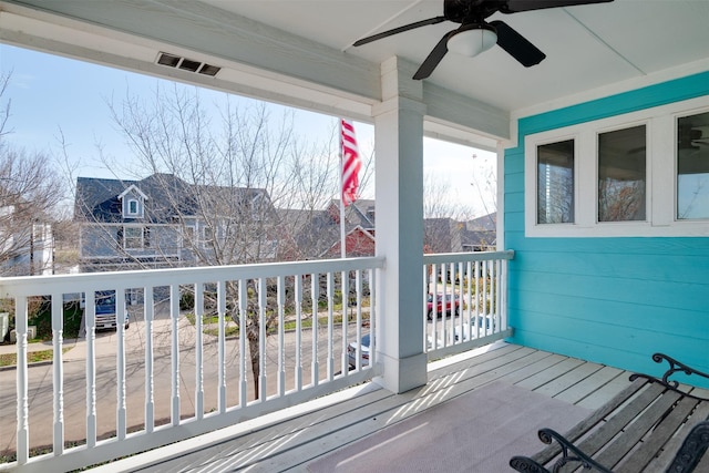 wooden terrace with ceiling fan