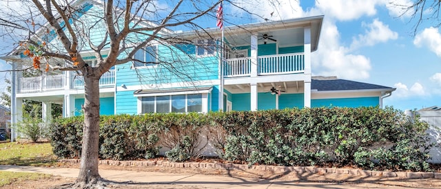 exterior space featuring a balcony and ceiling fan