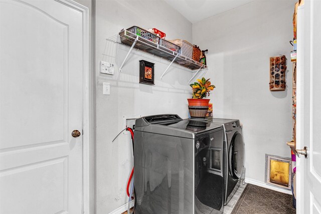 laundry room with independent washer and dryer