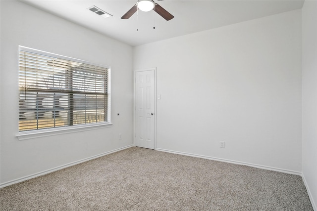 spare room with carpet flooring and ceiling fan