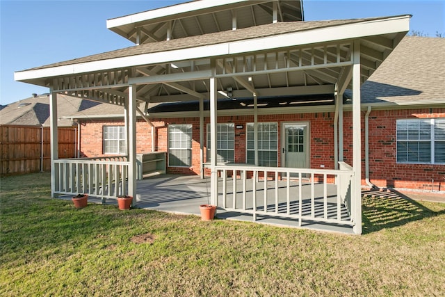 back of house featuring a yard