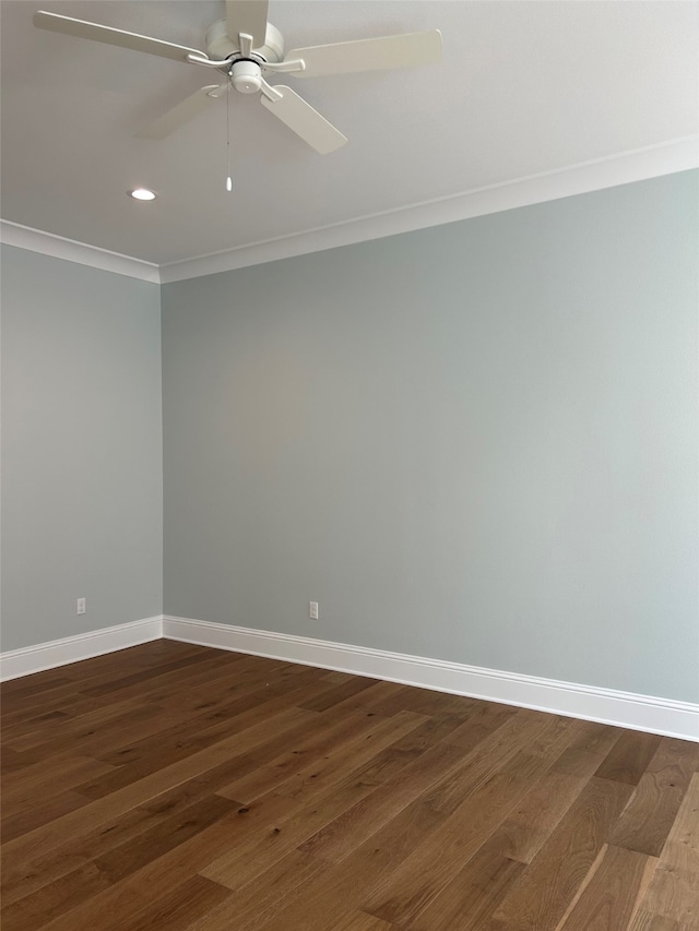 empty room with crown molding, ceiling fan, and dark hardwood / wood-style flooring