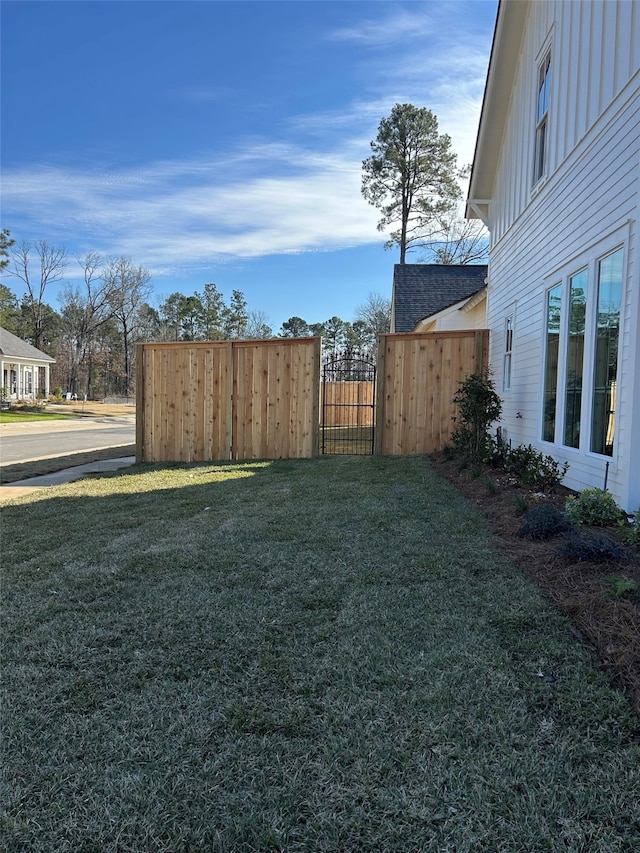 view of yard with a gate and fence