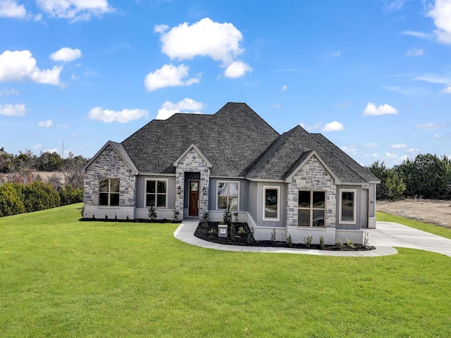 170 Fan Mill Trl, Weatherford, TX 76085 - french country home featuring a front lawn, roof with shingles, and stone siding