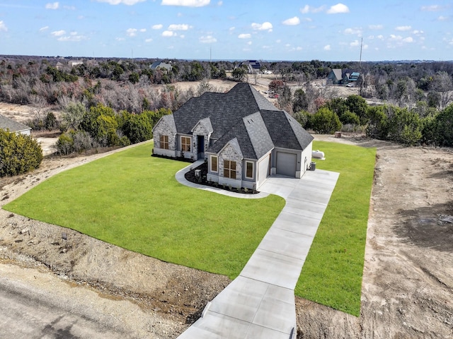 170 Fan Mill Trl, Weatherford, TX 76085 - view of front of property with stone siding, an attached garage, driveway, and a front yard