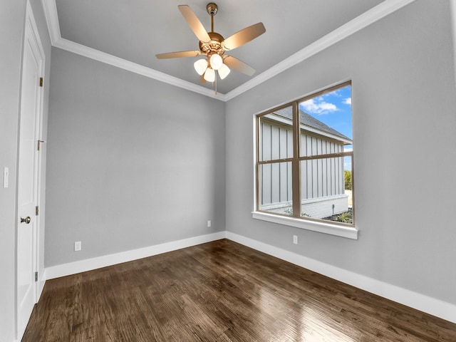 unfurnished room featuring dark hardwood / wood-style floors, ceiling fan, and crown molding