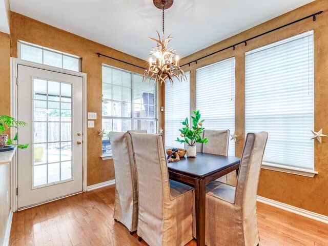 living room with ceiling fan with notable chandelier and carpet flooring