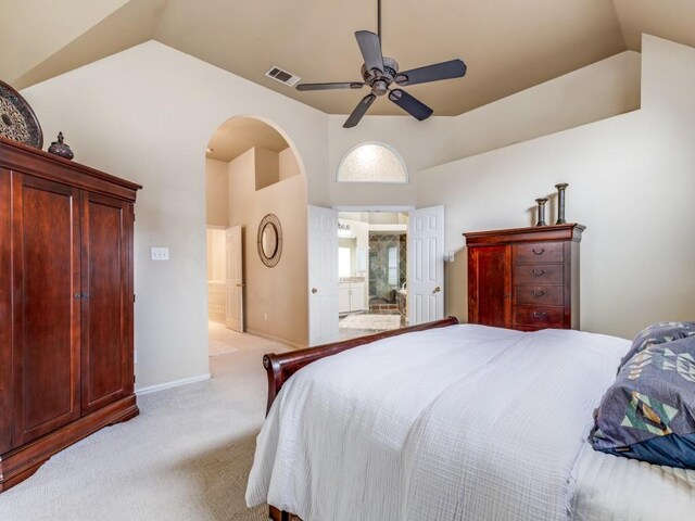 carpeted bedroom featuring ceiling fan and vaulted ceiling