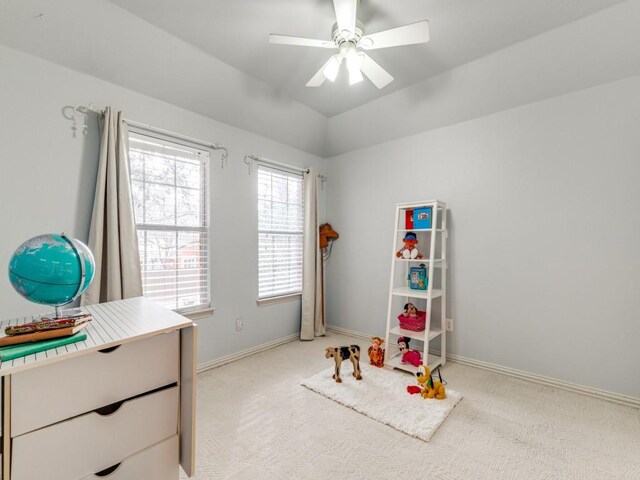 bathroom featuring plus walk in shower, vaulted ceiling, a healthy amount of sunlight, and vanity