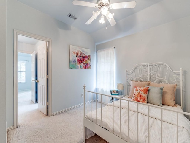 carpeted bedroom with lofted ceiling and ceiling fan