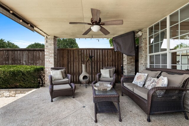 view of patio / terrace featuring ceiling fan, an outdoor hangout area, and a pool