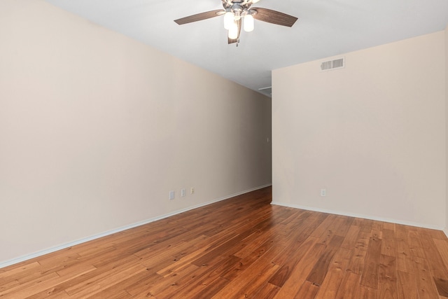 spare room featuring ceiling fan and light wood-type flooring