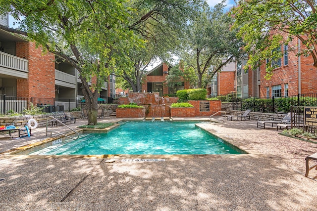 view of pool featuring a patio