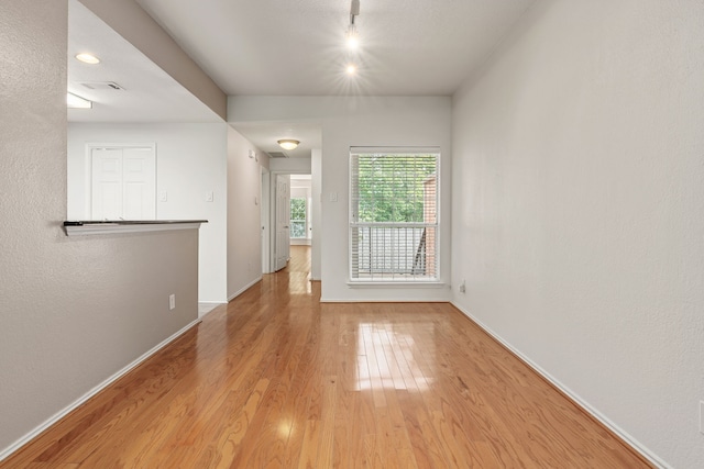 empty room with light hardwood / wood-style floors