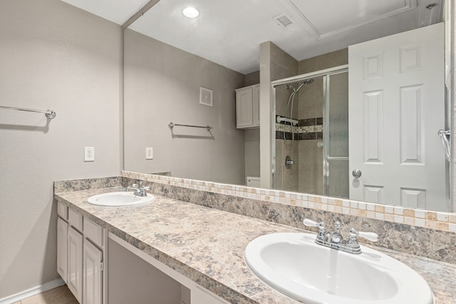 bathroom with vanity and an enclosed shower