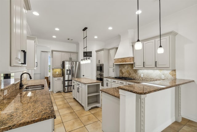 kitchen with stainless steel appliances, kitchen peninsula, pendant lighting, a kitchen island, and custom range hood