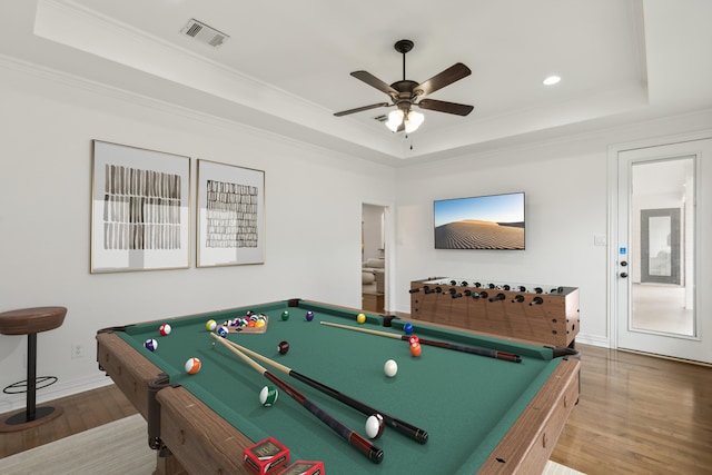 game room featuring hardwood / wood-style floors, a raised ceiling, and billiards