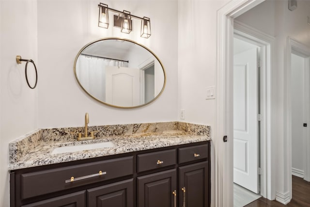 bathroom featuring vanity and wood-type flooring