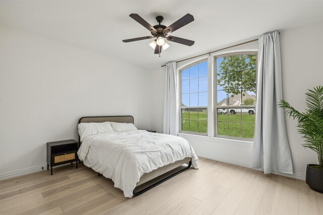 bedroom featuring ceiling fan and light hardwood / wood-style floors