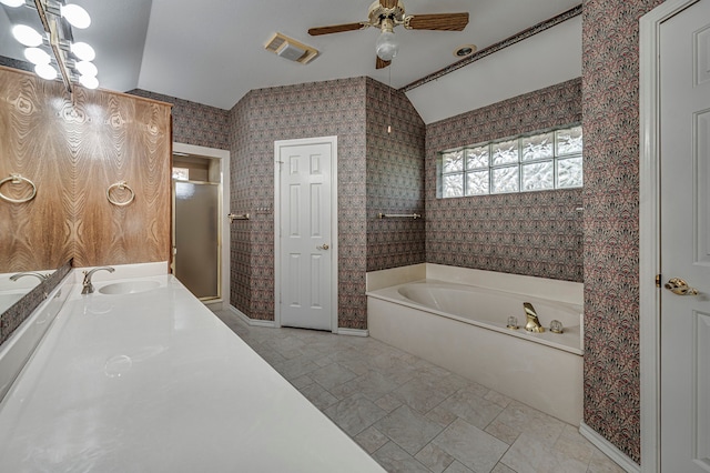 bathroom featuring ceiling fan, vanity, lofted ceiling, and independent shower and bath