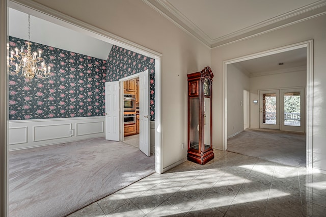 hall with light carpet, french doors, crown molding, and a notable chandelier