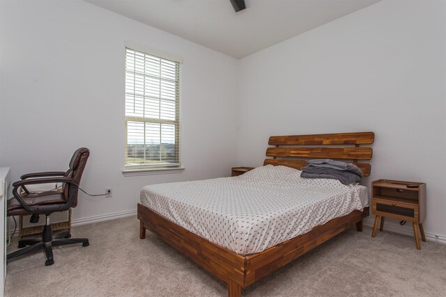 bedroom with light carpet and ceiling fan