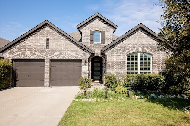 french country inspired facade with a garage and a front yard