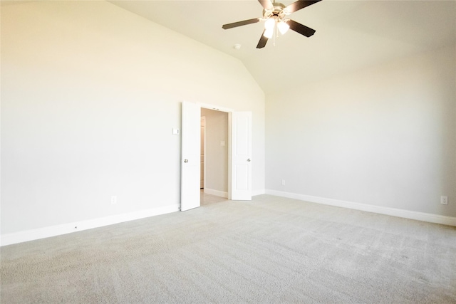 spare room featuring light carpet, high vaulted ceiling, and ceiling fan