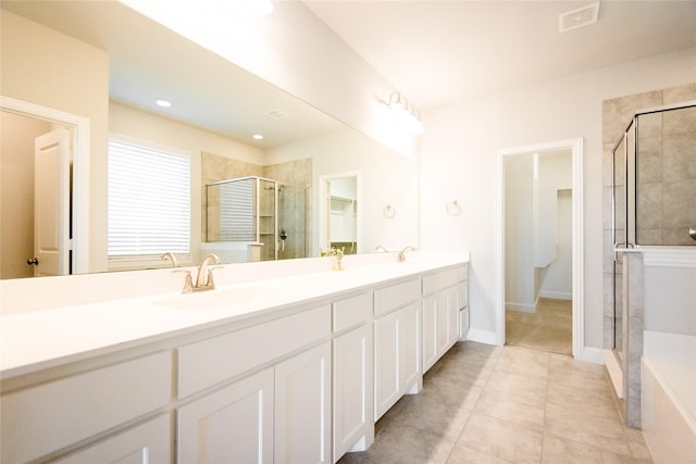 bathroom featuring an enclosed shower, vanity, and tile patterned floors