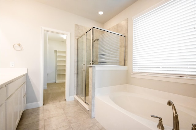 bathroom with vanity, tile patterned flooring, and separate shower and tub