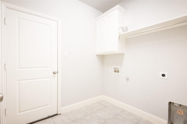 clothes washing area featuring cabinets, washer hookup, hookup for a gas dryer, and electric dryer hookup