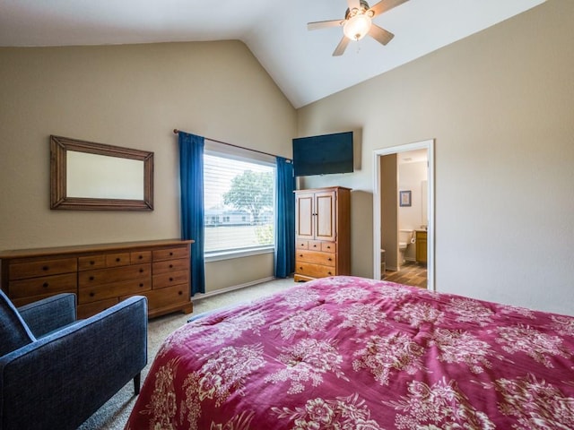 carpeted bedroom with connected bathroom, ceiling fan, and lofted ceiling